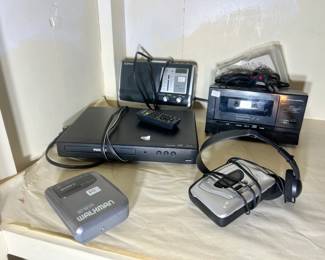 Vintage electronics including a Philips Blu-Ray player and various Sony portable audio devices