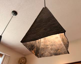 Custom made brutalist metal pendants made by our client in LA ca. 1972.  They are replicas of lighting in The Courthouse Restaurant in Hyde Park, Chicago