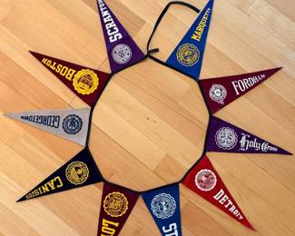 A sampling of the large collection of vintage pendants, from college, sports, national parks and more, including this ca. 1950’s Jesuit Colleges & Universities mini pennant banner