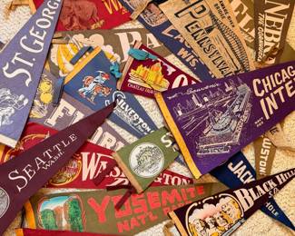 A sampling of the large collection of vintage pendants, from college, sports, national parks and more