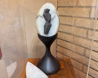 “The Egg” alabaster and graphite sculpture on wood base with lit acrylic cover.  This will be sold on the custom walnut stand.  Created by our client in 1967