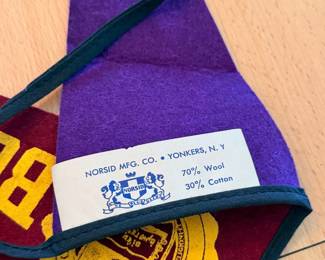 A sampling of the large collection of vintage pendants, from college, sports, national parks and more, including this ca. 1950’s Jesuit Colleges & Universities mini pennant banner