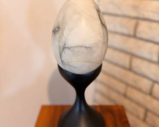 “The Egg” alabaster and graphite sculpture on wood base with lit acrylic cover.  This will be sold on the custom walnut stand.  Created by our client in 1967
