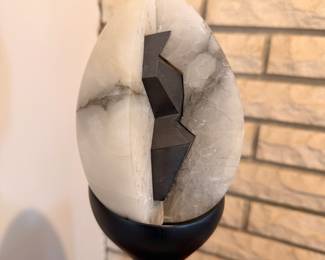 “The Egg” alabaster and graphite sculpture on wood base with lit acrylic cover.  This will be sold on the custom walnut stand.  Created by our client in 1967