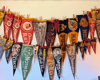 A sampling of the large collection of vintage pendants, from college, sports, national parks and more
