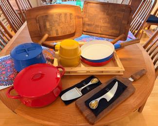 Selection of vintage Dansk enamel cookware and wood cutting boards.  The red fry pan has a large spot of enamel loss to the bottom
