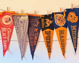 A sampling of the large collection of vintage pendants, from college, sports, national parks and more