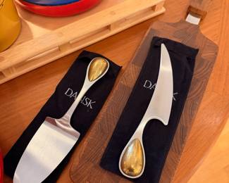 Selection of vintage Dansk enamel cookware and wood cutting boards.  The red fry pan has a large spot of enamel loss to the bottom