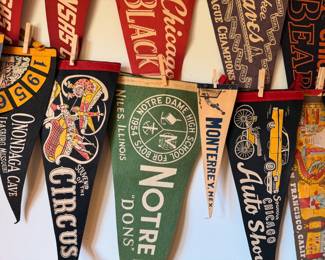 A sampling of the large collection of vintage pendants, from college, sports, national parks and more