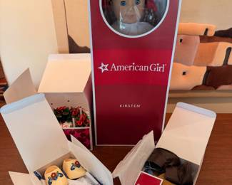 Retired and seemingly barely used AmericanGirl ‘Kirsten’ doll with original outfit, St. Lucia Holiday outfit and Kirsten’s Baking Outfit
