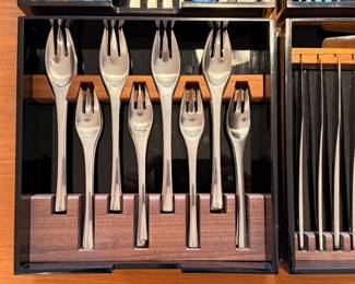 63 piece set of vintage Dansk ‘Odin’ stainless steel flatware. This set comes in four custom smokey black acrylic cases, two have custom walnut insterts
