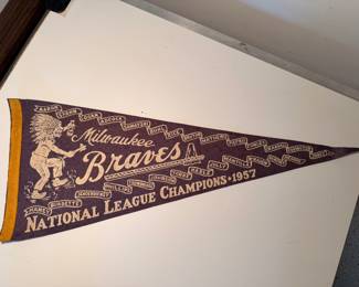 A sampling of the large collection of vintage pendants, from college, sports, national parks and more, including this very rare 1957 Milwaukee Braves National League Champions pennant with Hank Aaron and Warren Spahn