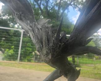A winged mystical garden creature  signed "Edwards 1973".  This sculpture appears to be made of bronze. Very heavy approximately  3ft wide by 2.5 feet high.