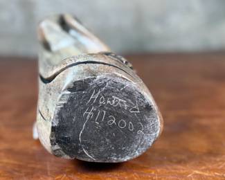 This lot features an original soapstone sculpture that’s believed to be by listed Cree artist, Howard Moose. Minor chipping throughout shown in photos and signed by Howard underneath. This sculpture measures, 9” H x 5.5” W x 5.5” D. Born in 1966, Moose began carving at age eight and transitioned from wood to stone mediums like soapstone and alabaster.