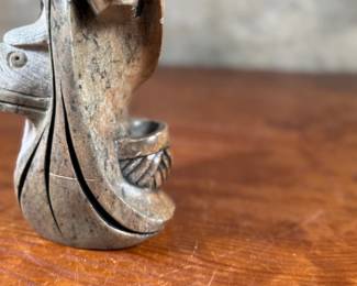 This lot features an original soapstone sculpture that’s believed to be by listed Cree artist, Howard Moose. Minor chipping throughout shown in photos and signed by Howard underneath. This sculpture measures, 9” H x 5.5” W x 5.5” D. Born in 1966, Moose began carving at age eight and transitioned from wood to stone mediums like soapstone and alabaster.