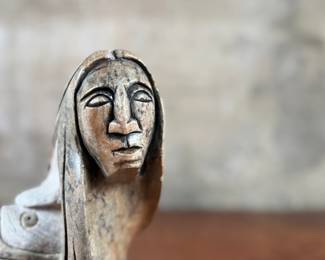 This lot features an original soapstone sculpture that’s believed to be by listed Cree artist, Howard Moose. Minor chipping throughout shown in photos and signed by Howard underneath. This sculpture measures, 9” H x 5.5” W x 5.5” D. Born in 1966, Moose began carving at age eight and transitioned from wood to stone mediums like soapstone and alabaster.