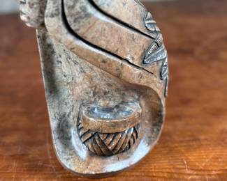 This lot features an original soapstone sculpture that’s believed to be by listed Cree artist, Howard Moose. Minor chipping throughout shown in photos and signed by Howard underneath. This sculpture measures, 9” H x 5.5” W x 5.5” D. Born in 1966, Moose began carving at age eight and transitioned from wood to stone mediums like soapstone and alabaster.