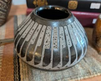 Pottery by It is done by R. Diane Martinez (often signing as R. Martinez), an award-winning artist and member of the Tarahumara Tribe