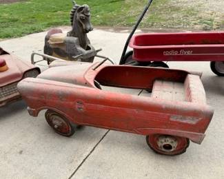 Metal pedal cars. Radio Flyers. Cast Aluminum Carousel style rocking horse.