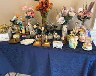 Hummel Bookends, figurines, silk flower arrangements.