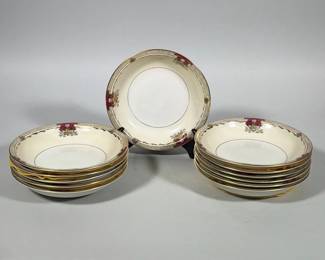 (12pc) MEITO CHINA SAVONA IVORY CHINA BOWLS | Group of eleven ivory-glazed porcelain bowls with an off-white well and a cream/ivory rim, each decorated with maroon cartouches, gilt floral sprays and a gilt rim band. Narrow gilt inner band encircles each bowl’s well; ornate gilt and patterned border decorates the rim. Underside printed backstamp reads "Empire Shape Meito China SAVONA Ivory China" with an additional "Made in Occupied Japan" mark. 