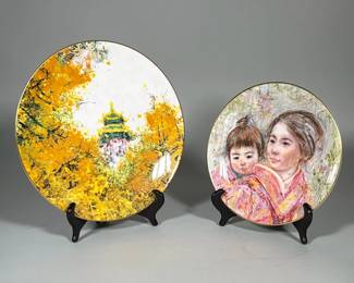 (2pc) ROYAL DOULTON 'IMPERIAL PALACE' (CHEN CHI) DINNER PLATE AND 'SAYURI AND CHILD' (EDNA HIBEL) SALAD PLATE | Two Royal Doulton collectors plates: a 10.5 in. dinner plate titled 'Imperial Palace' after Chen Chi and a smaller salad plate titled 'Sayuri and Child' after Edna Hibel. The dinner plate shows a pagoda motif set within dense yellow foliage and is finished with a gilt rim. The salad plate depicts a woman carrying a child in pink robes, also with a gilt rim. Both plates are backstamped 'Collectors International by Royal Doulton' with edition information (Imperial Palace 1977, edition of 15,000, number S107; Sayuri and Child 1974, edition of 15,000).