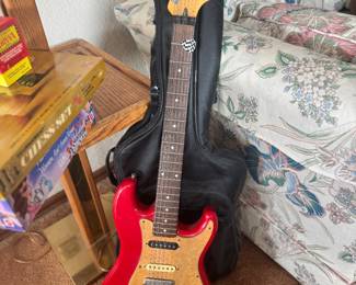 Red Squier Bullet electric guitar