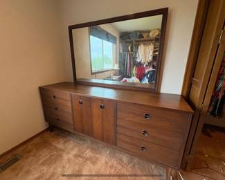 MCM walnut dresser featuring iconic bullseye pulls