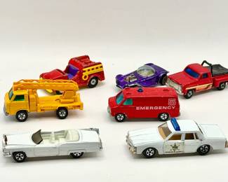 Vintage Toy Car Lot Feat. Dukes Of Hazard Ertl 1969 Cadillac DeVille Convertible diecast toy car from the Dukes of Hazzard TV show. 1980 Ertl The Dukes of Hazzard Sheriff Rosco P. Coltrane's police cruiser, modeled after a Pontiac Bonneville. Tomica Chevrolet Chevy Van Emergency model, specifically the No. F22 or F23 casting released in Japan during the late 1970s. Tomica Nissan Caball Skymaster diecast toy truck Yatming Chevy Stepside Pickup Aviva Snoopy Fire Truck Unmarked purple car-missing whee