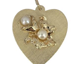 A 14k Gold and Pearl Charm