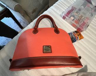 Large collection of new Dooney and Bourke handbags / at least 20