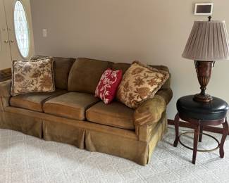 Couch, leather stool, lamp