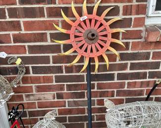Antique tiller blade made into lawn art