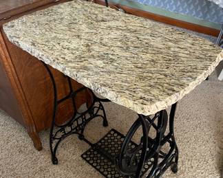 Marble table top table on antique sewing machine stand/feet