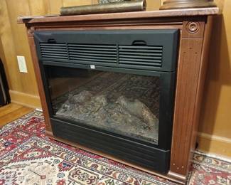 Portable fireplace-style electric heater
