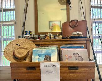 Many record albums and lots of fishing rods and reels