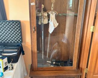 Gun cabinet with 2 swords
