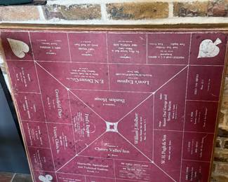 Card table with local Morrisville businesses advertising on it. Double digit phone numbers. 