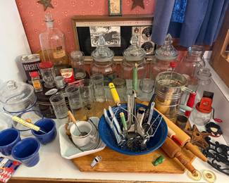Antique store counter jars, rolling pins, apothecary jars, kitchen utensils, pottery