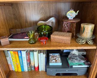 Ukulele, green glass, vhs player, books