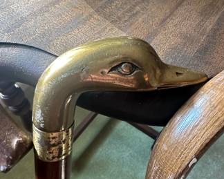 Collection of Four Walking Canes, including a Brass Duck Head Cane