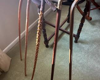 Collection of Four Walking Canes, including a Brass Duck Head Cane