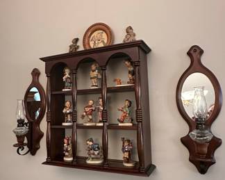 Hummel Figurine Collection with Wooden Display Shelf and Wall Sconces