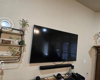 TV with sound bar and other home theater equipment