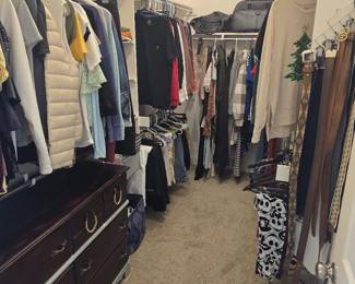 Walk-in closet full of ladies' clothing