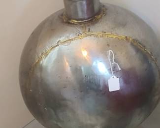 Large round metal vase