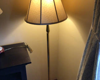 Lot 146: Brass floor lamp with square decorative base and fabric shade