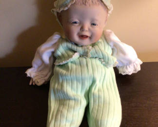 Lot 176: Vintage doll in mint-green outfit with lace bonnet