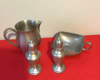 Lot 49: Pewter pitcher, salt and pepper shakers, and serving dish