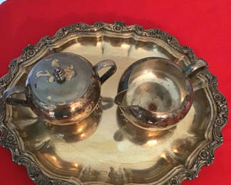 Lot 73: Silverplate creamer, sugar bowl with lid, and ornate serving tray